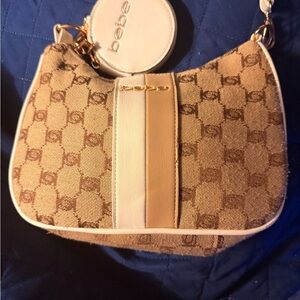 Bebe monogram baguette shoulder bag with a small, detachable coin pouch